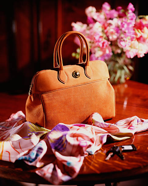 luxury hand bag on table - fashion stock pictures, royalty-free photos & images