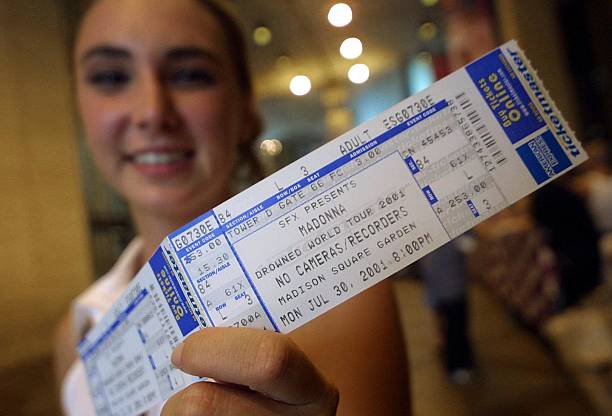 Madonna fan holds a cherished ticket prior to Madonna''s concert July 25, 2001 at Madison Square Garden in New York City.