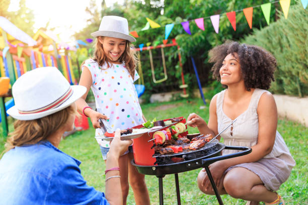 making barbecue at backyard - garden decoration stock pictures, royalty-free photos & images