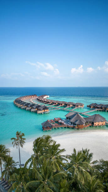 maldives hotel beach resort on tropical island with aerial drone view - travel stock pictures, royalty-free photos & images