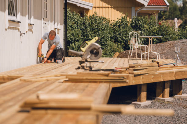 man building a wooden patio deck outdoors in his garden - home decoration stock pictures, royalty-free photos & images