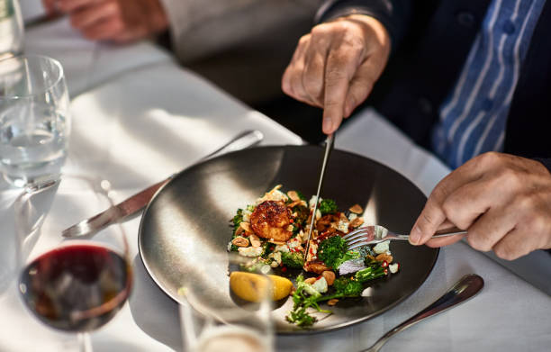 man eating freshly prepared meal in restaurant - food stock pictures, royalty-free photos & images