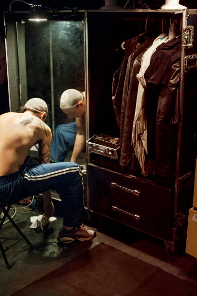 man getting dressed for music concert - concert stock pictures, royalty-free photos & images
