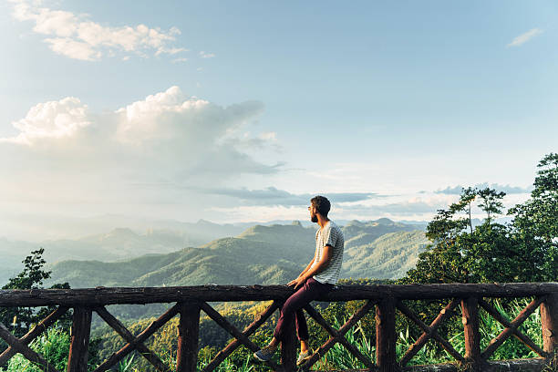 man in mountains at sunset in thailand - travel stock pictures, royalty-free photos & images