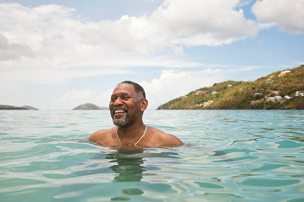 man in ocean - travel stock pictures, royalty-free photos & images