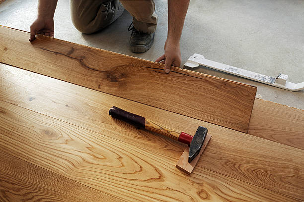 man laying finished parquet flooring, close-up - home decoration stock pictures, royalty-free photos & images