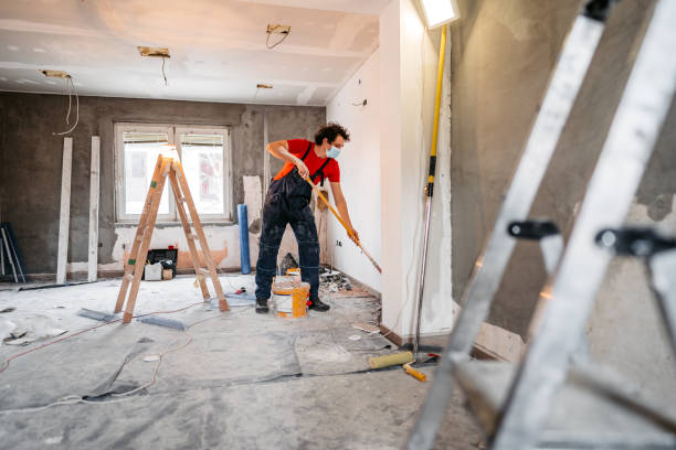 man painting apartment walls - home decoration stock pictures, royalty-free photos & images