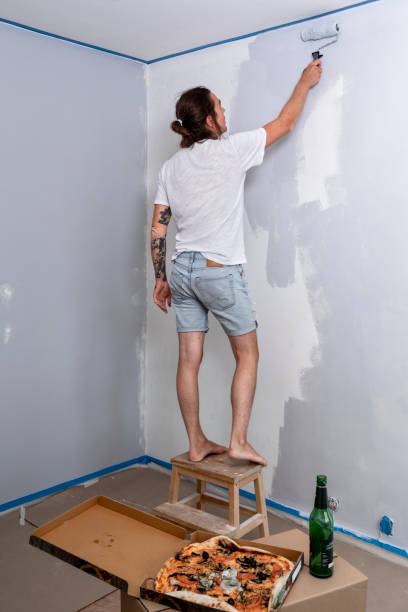 man painting walls at home - home decoration stock pictures, royalty-free photos & images
