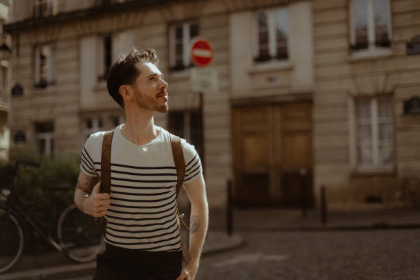 man standing in place de l'estrapade, paris - filming location for emily in paris - fashion stock pictures, royalty-free photos & images