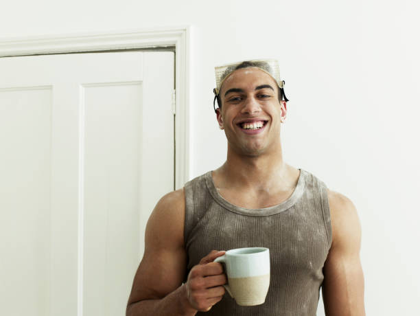 man taking a break with a cup of coffee - home decoration stock pictures, royalty-free photos & images