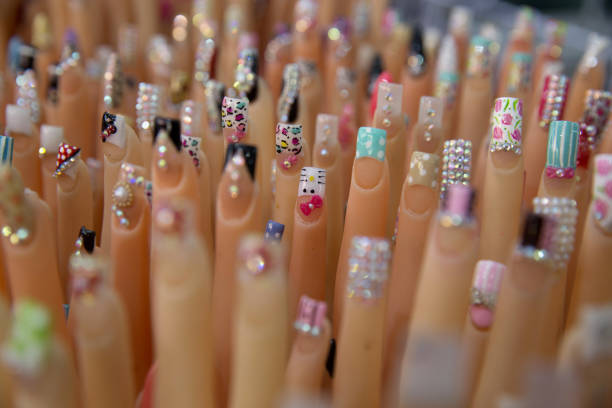 mannequin hands display different types of nail art - nails art stock pictures, royalty-free photos & images