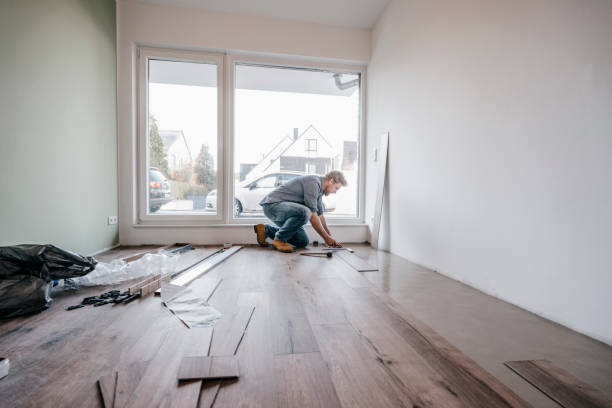 mature man fitting flooring in new home - home decoration stock pictures, royalty-free photos & images
