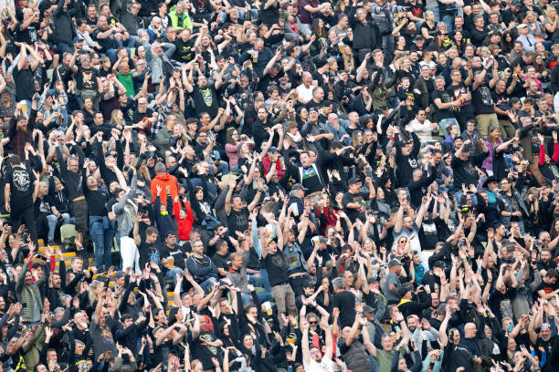May 2024, Bavaria, Munich: Fans watch the concert by US metal band Metallica in the Olympic Stadium. The band is performing as part of their "M72...