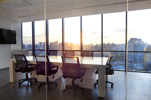 meeting room with glass wall cityscape and sunset - home decoration stock pictures, royalty-free photos & images