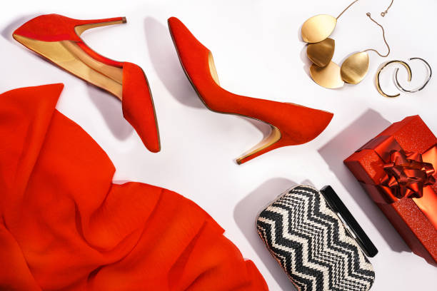 merry christmas and happy new year party concept with red shoes, make-up and beauty accessories. - fashion fotografías e imágenes de stock