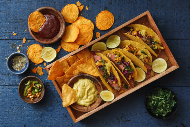 mexican crunchy taco shells with beef and vegetables - junk food stock pictures, royalty-free photos & images