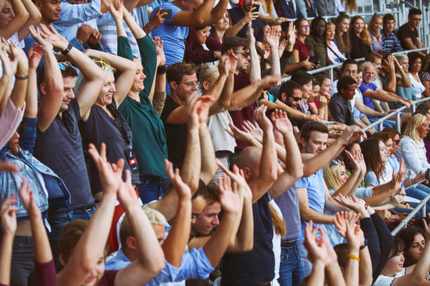 mexican wave on stadium - concert stock pictures, royalty-free photos & images