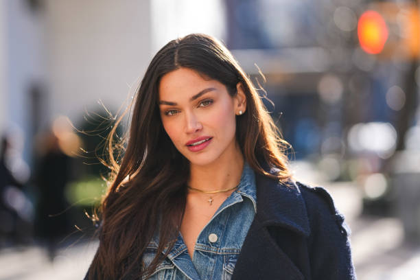 Michelle Ivana wears gold necklace, navy blue half buttoned denim jean jacket, outside Coach, during the New York Fashion week Fall/Winter 2025 on...