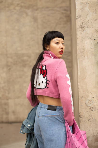 Michelle Song is seen on the street during Paris Fashion Week SS19 wearing Hello Kitty crop sweater and torn denim on October 2, 2018 in Paris,...