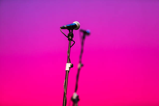 microphone feet with microphones over pink and purple - concert stock pictures, royalty-free photos & images