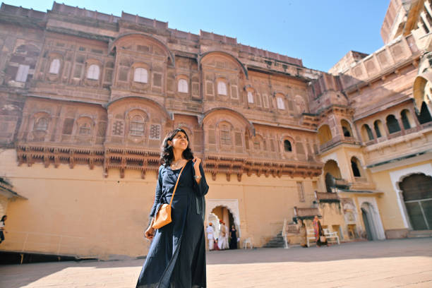 mid adult tourist woman exploring one of the largest fort meharangarh fort, jodhpur - travel stock pictures, royalty-free photos & images