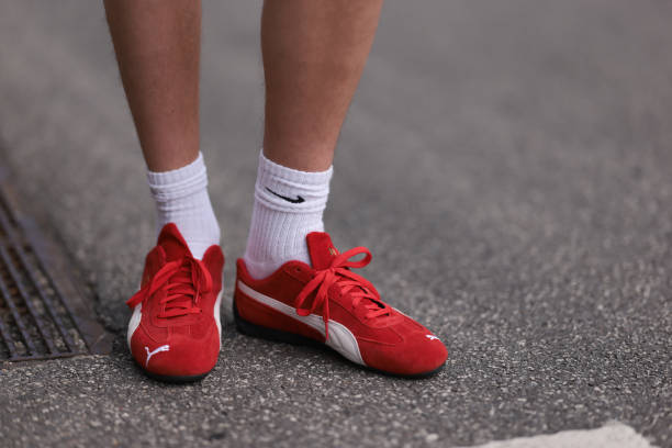 Mike Bjørnbak is seen wearing white socks from Nike, and “Speedcat“ sneakers in red suede from Puma before the Gestuz Show during the Copenhagen...