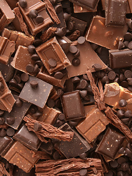 milk chocolate chunks - junk food stock pictures, royalty-free photos & images