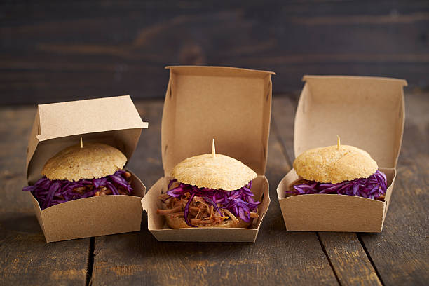 mini-burger with pulled pork, red cabbage and fried onions in boxes - junk food stock pictures, royalty-free photos & images