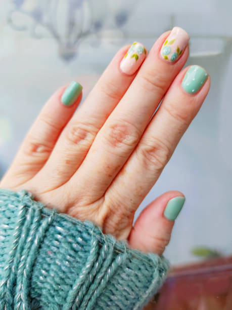 mint and skin tones nails art with rose flowers - nails art stock pictures, royalty-free photos & images