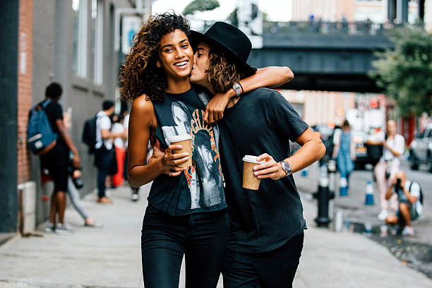 Model couple Imaan Hammam and Naleye Junior outside Blue Bottle Coffee at Milk Studios on September 12, 2015 in New York City.