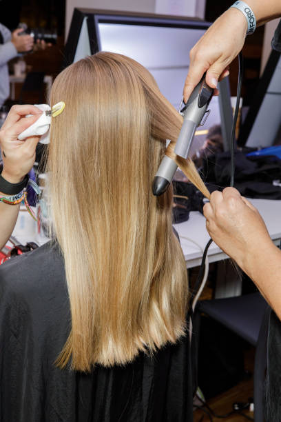 Model, hair detail, backstage ahead of the Tom Ford fashion show during the Milan Fashion Week Womenswear Spring/Summer 2024 on September 21, 2023 in...
