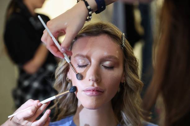 Model is being styled backstage ahead of the Ewa Herzog show during Berlin Fashion Week SS25 at Koenig Galerie on July 02, 2024 in Berlin, Germany.