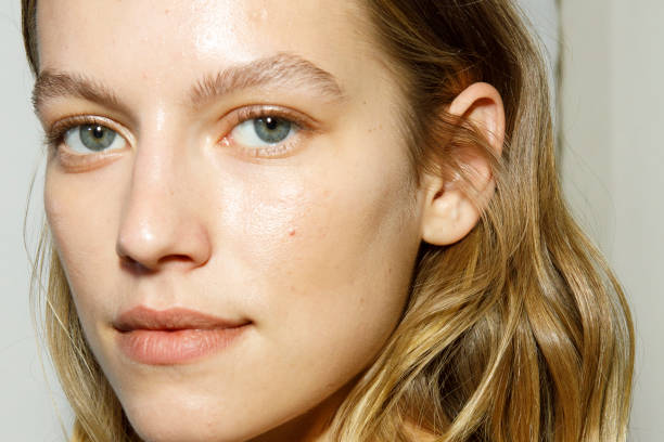 Model, make up detail, poses backstage at the Ermanno Scervino Fashion Show during the Milan Fashion Week Womenswear Spring/Summer 2023 on September...
