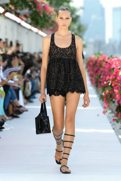 Model on the runway at Michael Kors Spring 2024 Ready To Wear Fashion Show at Domino Park on September 11, 2023 in Brooklyn, New York.