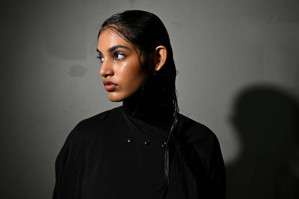 Model poses backstage ahead of the David Jones Indigenous Fashion Projects show during Australian Fashion Week Presented By Pandora 2024 at...