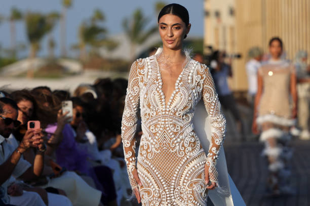 Model presents a creation of Saudi designer Tima Abid during the Red Sea Fashion Week in Saudi Arabia's Red Sea resort of Ummahat Island, on May 16,...