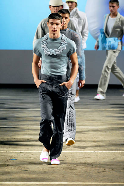 Model walks down the catwalk during the KJ by Kim Jones show during the London Fashion Week 2007 for Spring Summer 08 on September 20, 2007 in...