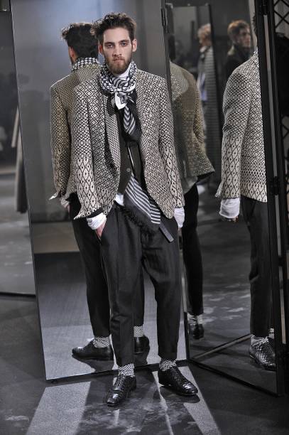 Model walks the runway during the Haider Ackermann Ready to Wear Menswear Fall/Winter 2014-2015 show as part of Paris Fashion Week on January 15,...