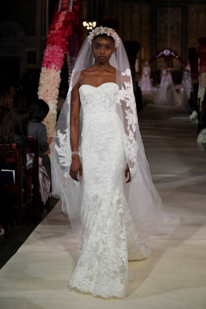 Model walks the runway wearing Reem Acra Bridal on April 11, 2019 in New York City.