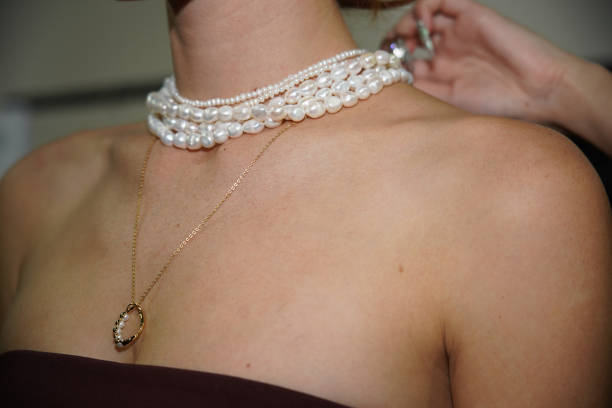 Model, wearing Pandora jewellery, prepares backstage ahead of the Pandora's Closing Night show during Australian Fashion Week Presented By Pandora...