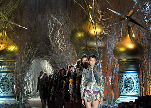 Models walk down the runway at the Just Cavalli fashion show as part of Milan Fashion Week Autumn/Winter 2005/6 at " Fabbrica del Vapore" on February...