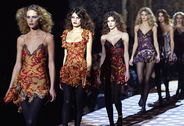 Models wear creations as part of Italian designer Roberto Cavalli's Autumn/Winter 2004-2005 women's collection at Milan's fashion week 27 February...