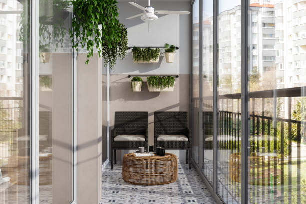 modern enclosed balcony with wicker chairs, coffee table and creeper plants - garden decoration stock pictures, royalty-free photos & images