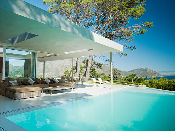 modern home, patio and infinity swimming pool - home decoration stock pictures, royalty-free photos & images