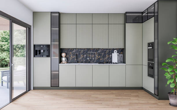 modern khaki green kitchen with a space (for an island or a table) on the hardwood floors and a large open window door with a garden view on the side - garden decoration stock pictures, royalty-free photos & images