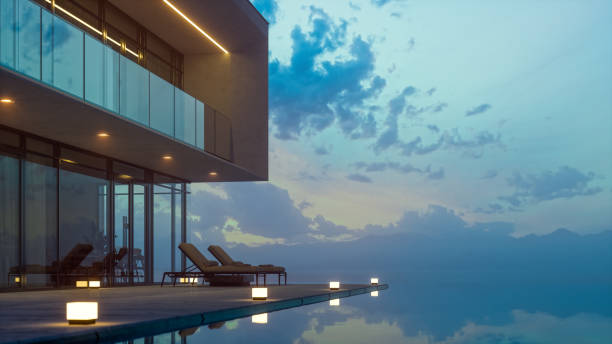 modern luxury house with private infinity pool in dusk - travel stock pictures, royalty-free photos & images