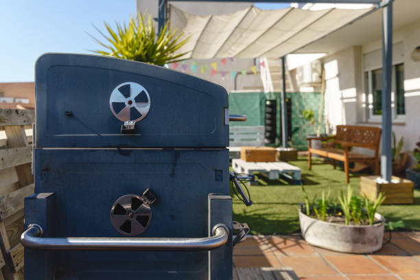 modern set of barbecue at backyard terrace in summer time - garden decoration stock pictures, royalty-free photos & images