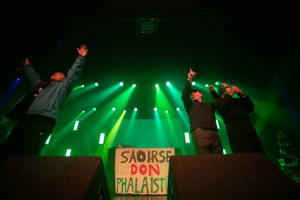 Moglai Bap, Mo Chara and DJ Provai of Kneecap performs at The 3Olympia Theatre Dublin on December 12, 2023 in Dublin, Ireland.