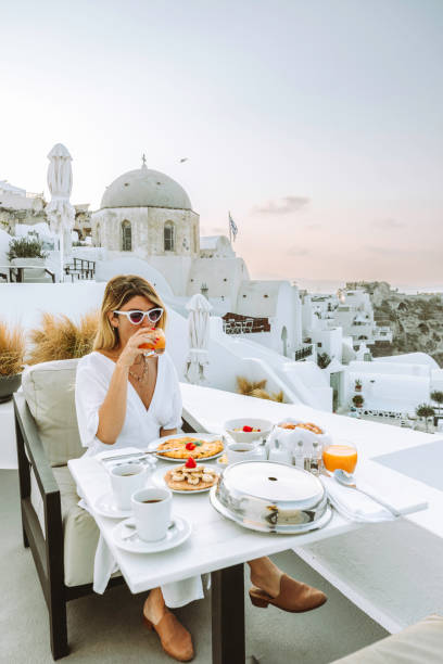 morning bliss: luxury breakfast with a view in oia, santorini - travel stock pictures, royalty-free photos & images