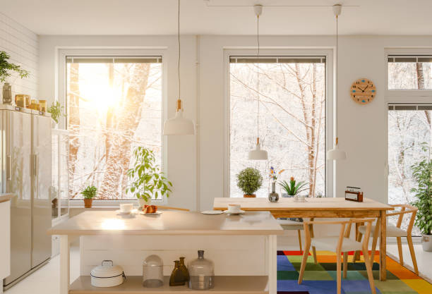 morning sun streaming into the kitchen, winter scene - home decoration stockfoto's en -beelden